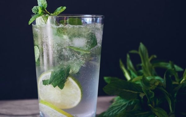 Iced drink with fresh lime and ice cubes